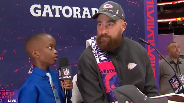 11-year-old reporter Jeremiah Fennell interviews Travis Kelce at opening night of Super Bowl LVIII in Las Vegas.